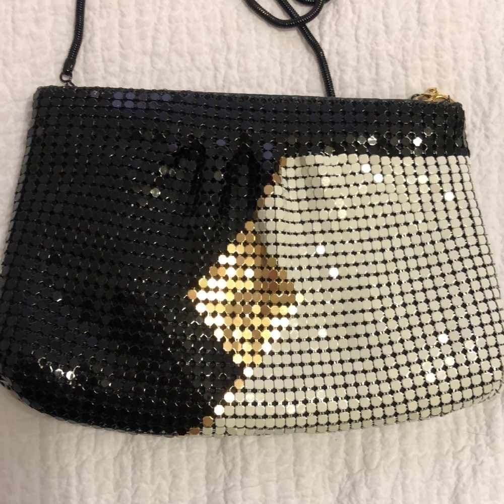 Vintage black, white, and gold mesh shoulder bag with zipper close.